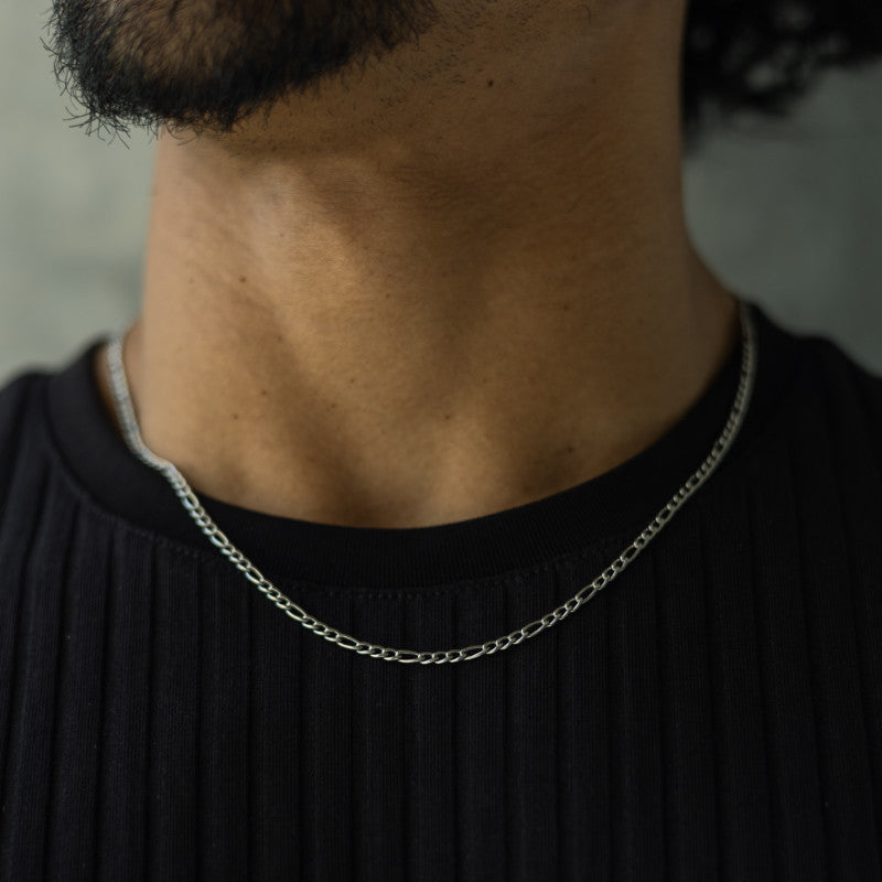 Silver men's figaro chain necklace.