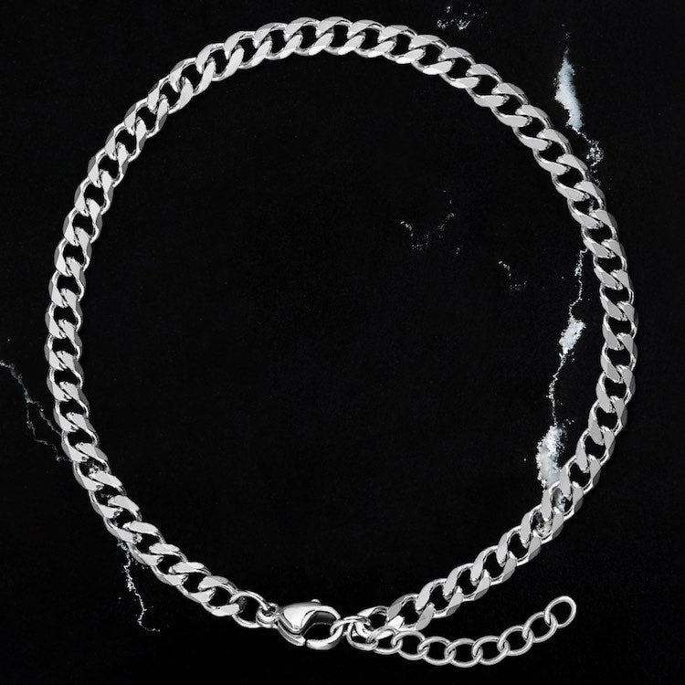 Our Silver Cuban Chain Bracelet features our premium silver cuban chain and signature polished silver plate, engraved with RG&B.