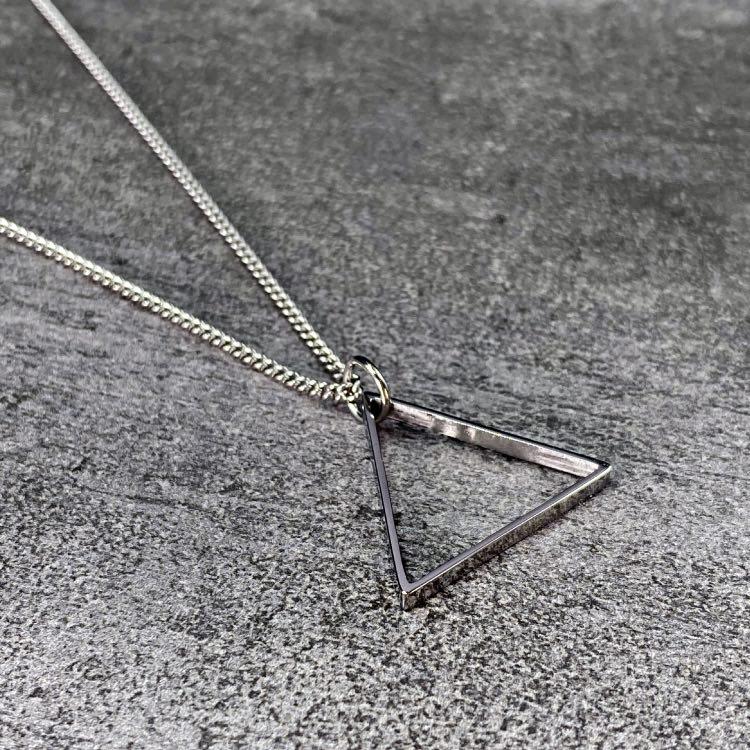 Silver Triangle Necklace - Our Silver Triangle Necklace features our Signature Triangle Pendant and Cuban Link Chain. The Perfect piece for any wardrobe.