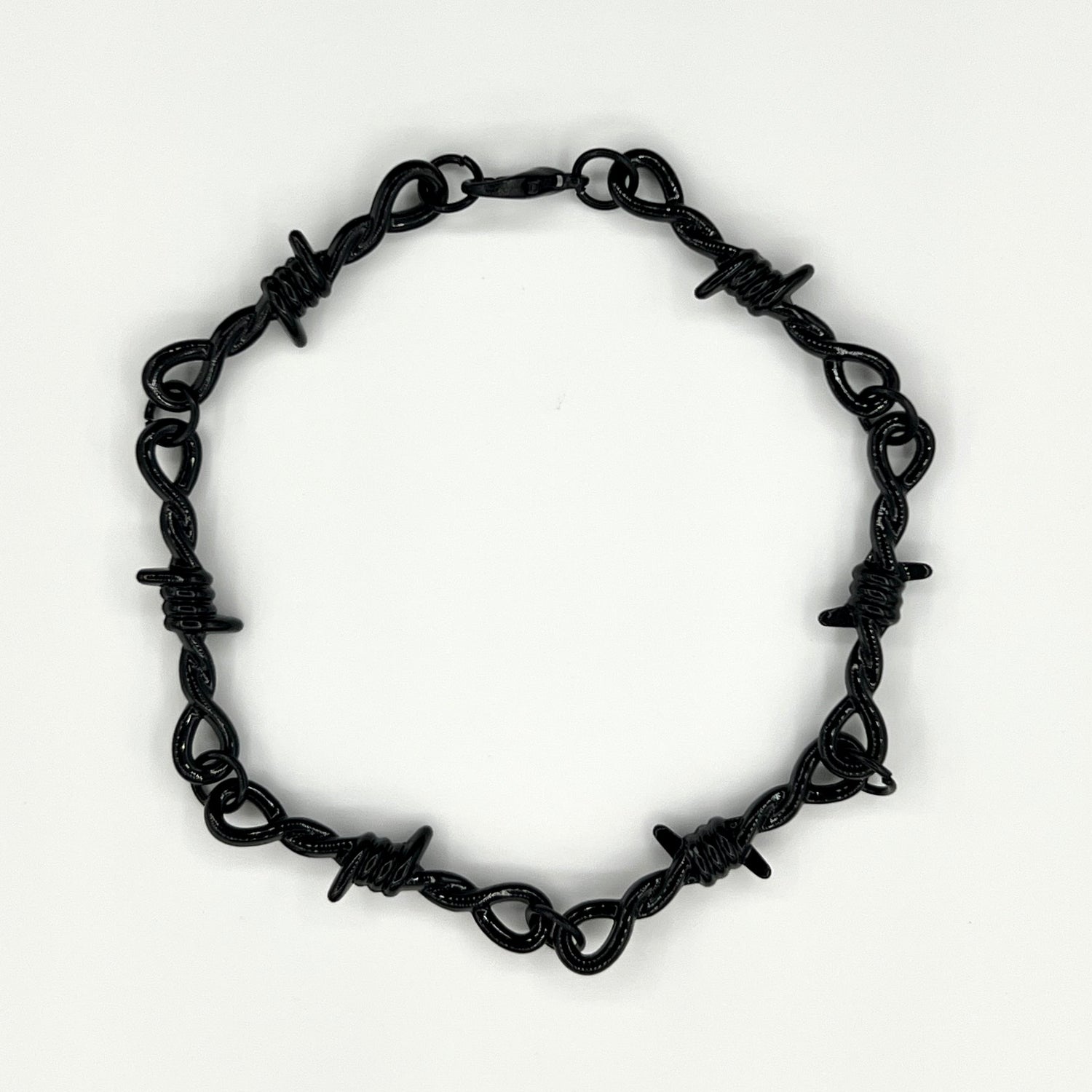 Our black barbed wire chain bracelet for men features a solid barbed wire style chain along with an adjustable clasp.