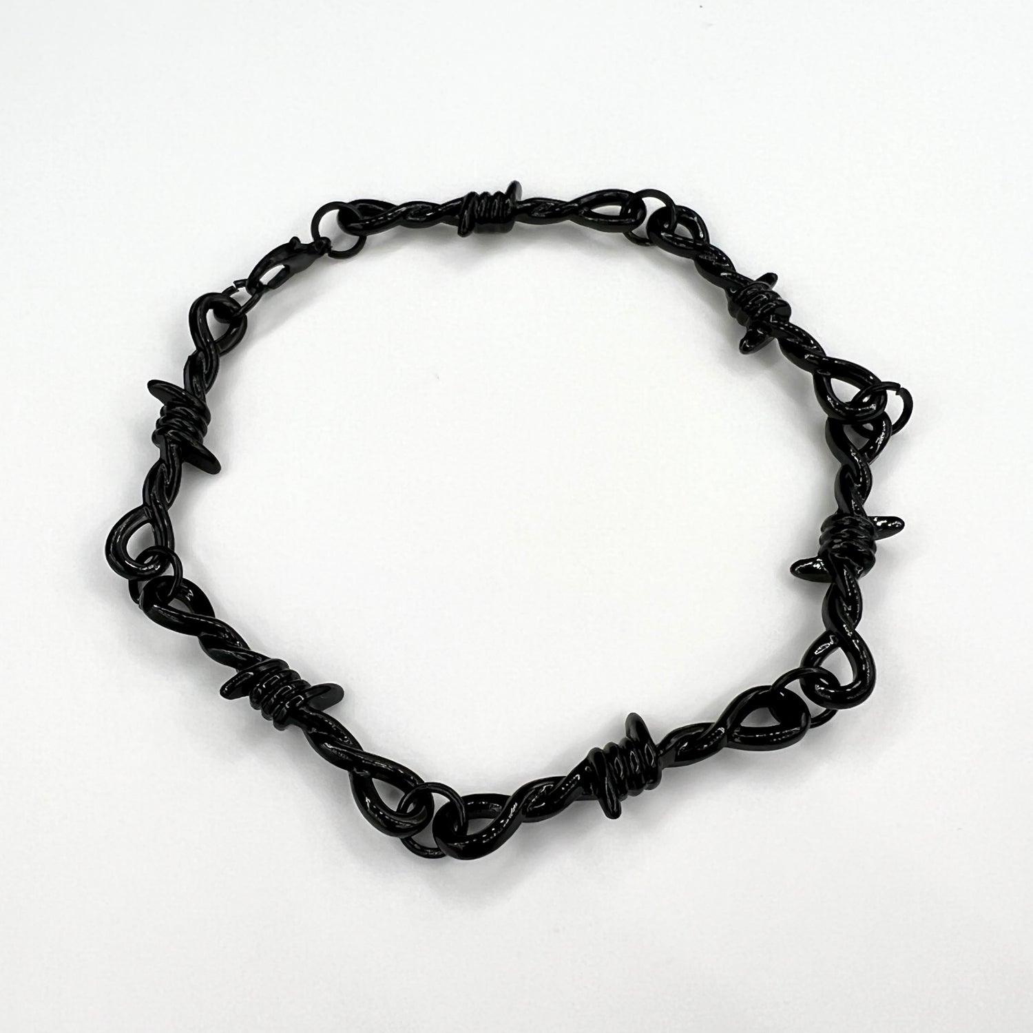 Our black barbed wire chain bracelet for men features a solid barbed wire style chain along with an adjustable clasp.