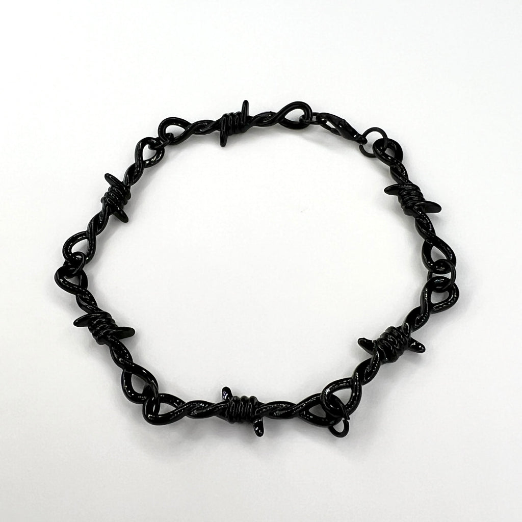 Our black barbed wire chain bracelet for men features a solid barbed wire style chain along with an adjustable clasp.