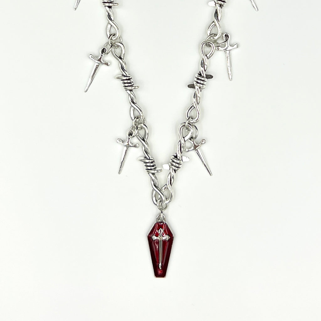 Our Crimson Dagger Pendant Necklace has been hand crafted using our silver barbed wire link chain and our crimson dagger pendant.