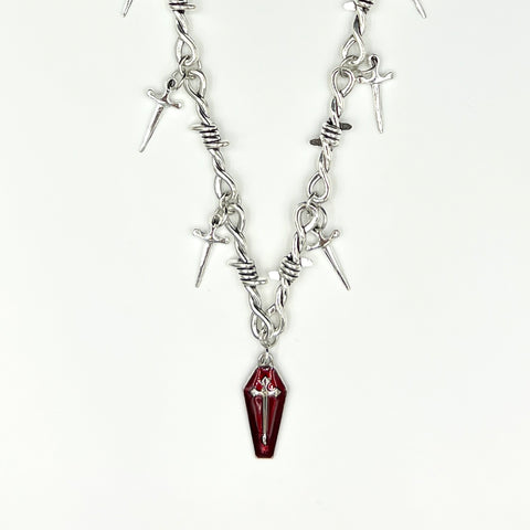 Our Crimson Dagger Pendant Necklace has been hand crafted using our silver barbed wire link chain and our crimson dagger pendant.