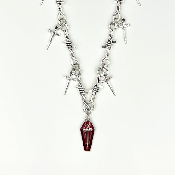 Our Crimson Dagger Pendant Necklace has been hand crafted using our silver barbed wire link chain and our crimson dagger pendant.