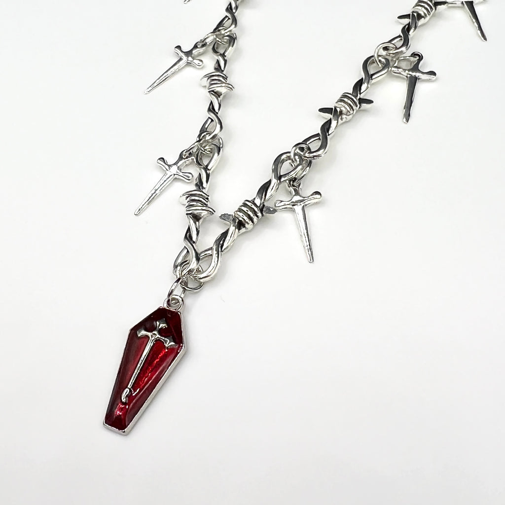 Our Crimson Dagger Pendant Necklace has been hand crafted using our silver barbed wire link chain and our crimson dagger pendant.