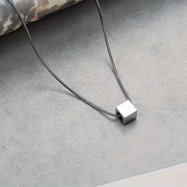 Our Minimal Cube Pendant Necklace has been crafted with our premium cube pendant and signature snake chain.