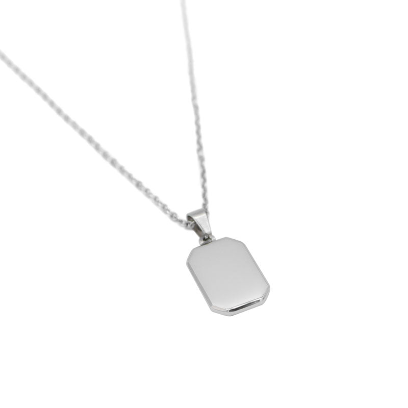 Minimal tag pendant necklace in silver. Rose gold and black.