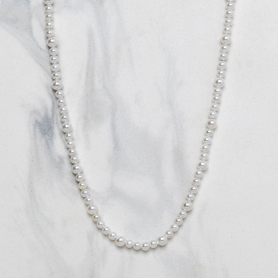 Our Asymmetric Pearl Necklace has been crafted using different sized polished white pearls, along with the finest silver hardware to hold it all together.