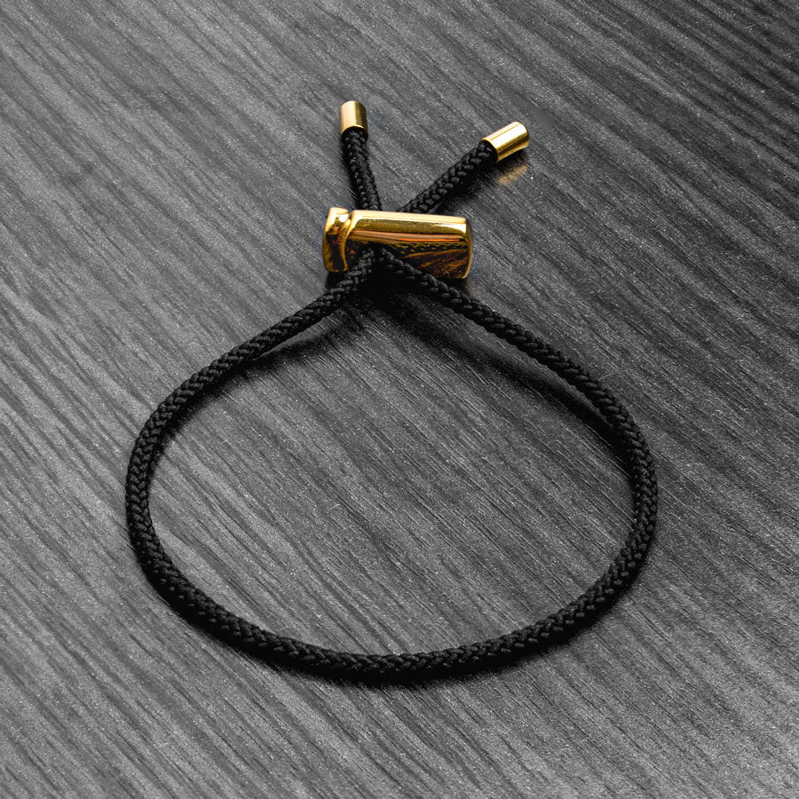 Our Black & Gold Drawstring Bracelet has been crafted using the finest braided maritime grade nylon rope.