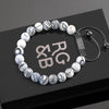 Black Network Bead Bracelet - Our Black Network Stone Bead Bracelet Features Natural Stones, Waxed Cord and Brushed Black Steel Hardware. A Beautiful Addition to any Collection.