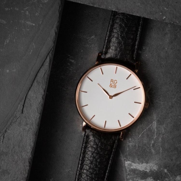 Rose Gold Minimal Watch - Explore our Classic Minimal Watch in Rose Gold & Black. Featuring a Polished Rose Gold Case, Hands & Hour Markers, a White Dial and a Black Leather Strap.