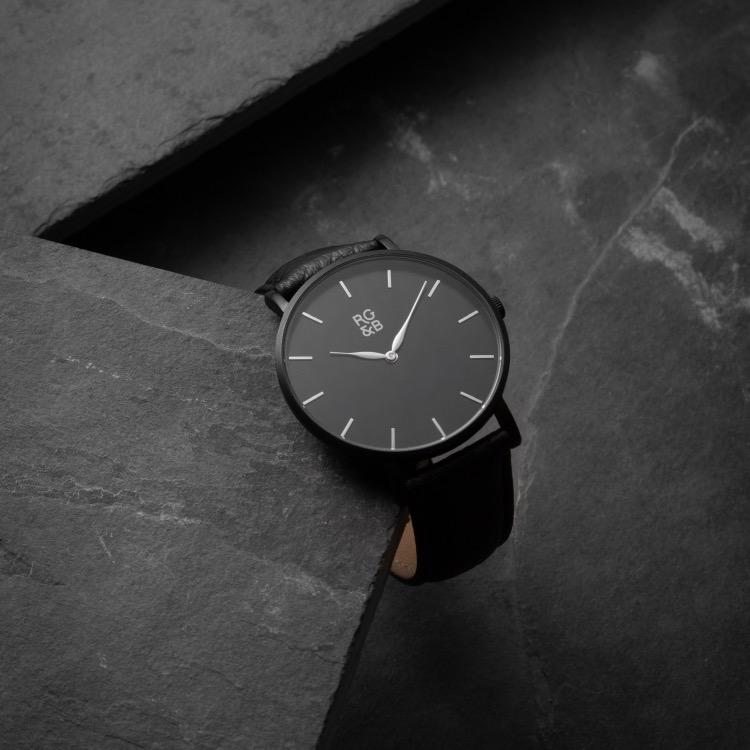 Black Minimal Watch - Explore our Classic Minimal Watch in All Black. Featuring a Brushed Black Case, Gunmetal Hands & Hour Markers, a Black Dial and a Black Leather Strap.