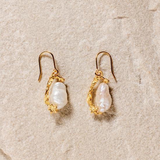 Women's Pearl Earrings - Fine wire hook earring featuring a uniquely molded Flower combined with a precious rough pearl to form a timelessly beautiful pendant. Fine brass, plated with gold or rose gold.