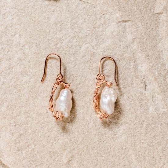 Women's Pearl Earrings - Fine wire hook earring featuring a uniquely molded Flower combined with a precious rough pearl to form a timelessly beautiful pendant. Fine brass, plated with gold or rose gold.