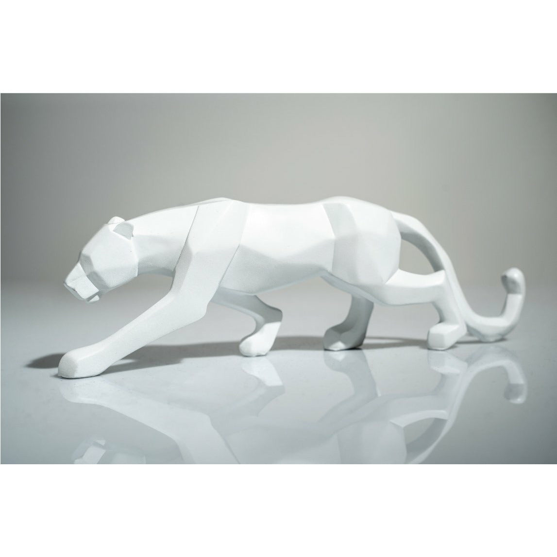 White Leopard Sculpture - Our White Leopard Sculpture is the perfect addition to any space. Also available in Black.