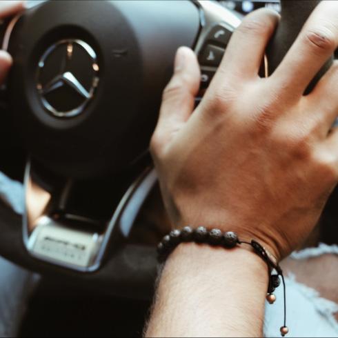 Lava Stone Bead Bracelet - Our Lava Stone Bead Bracelet Features Natural Stones, Waxed Cord and Brushed Rose Gold Steel Hardware, Engraved with the Signature RG&B Logo.