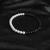 Our Pearl & Black Bead Bracelet has been crafted using both polished white pearls and black beads.