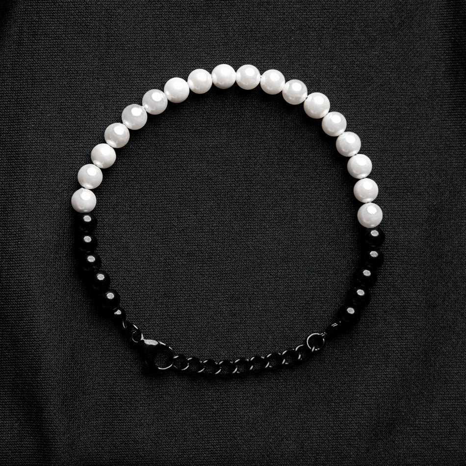 Our Pearl & Black Bead Bracelet has been crafted using both polished white pearls and black beads.