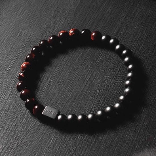 Red Tiger Eye Bead Bracelet - Our Red Tiger Eye Bead Bracelet Features 6mm Natural Stones, Premium Elastic Cord and Brushed Black Hardware. A Beautiful Addition to any Collection.