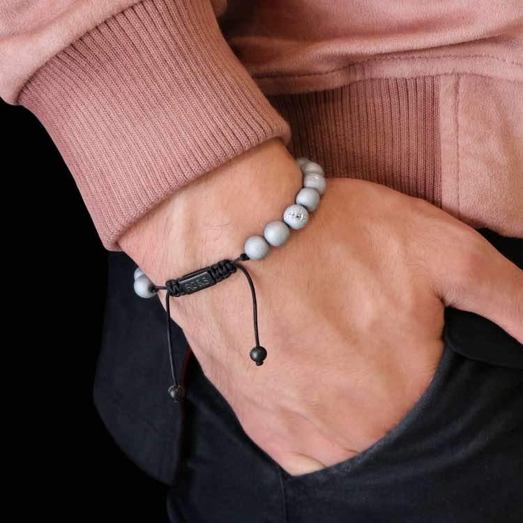 Smile Agate Bead Bracelet - Our Smile Agate Bead Bracelet Features Natural Stones, Waxed Cord and Brushed Black Steel Hardware. A Beautiful Addition to any Collection.