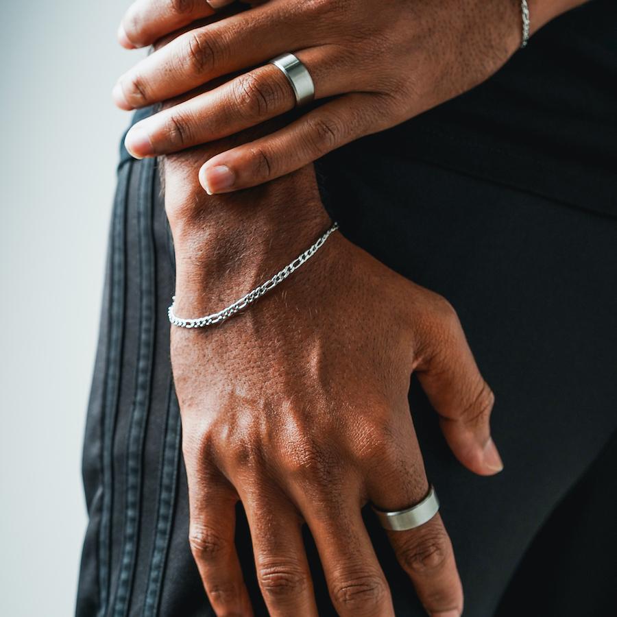 Our Silver Figaro Chain Bracelet features our premium silver figaro chain and signature polished silver plate, engraved with RG&B.