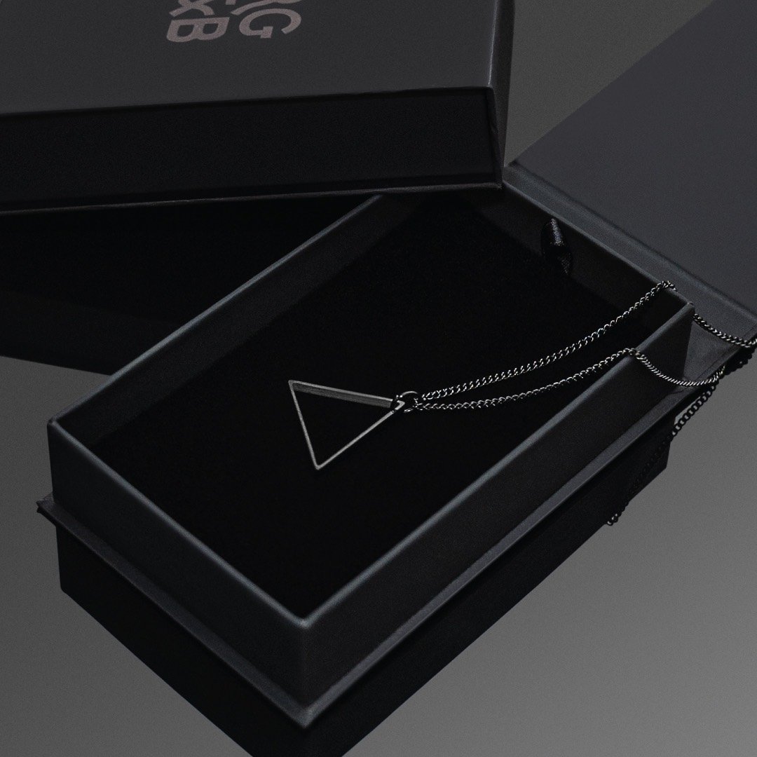 Black Triangle Necklace - Our Black Triangle Necklace features our Signature Triangle Pendant and Cuban Link Chain. The Perfect piece for any wardrobe.